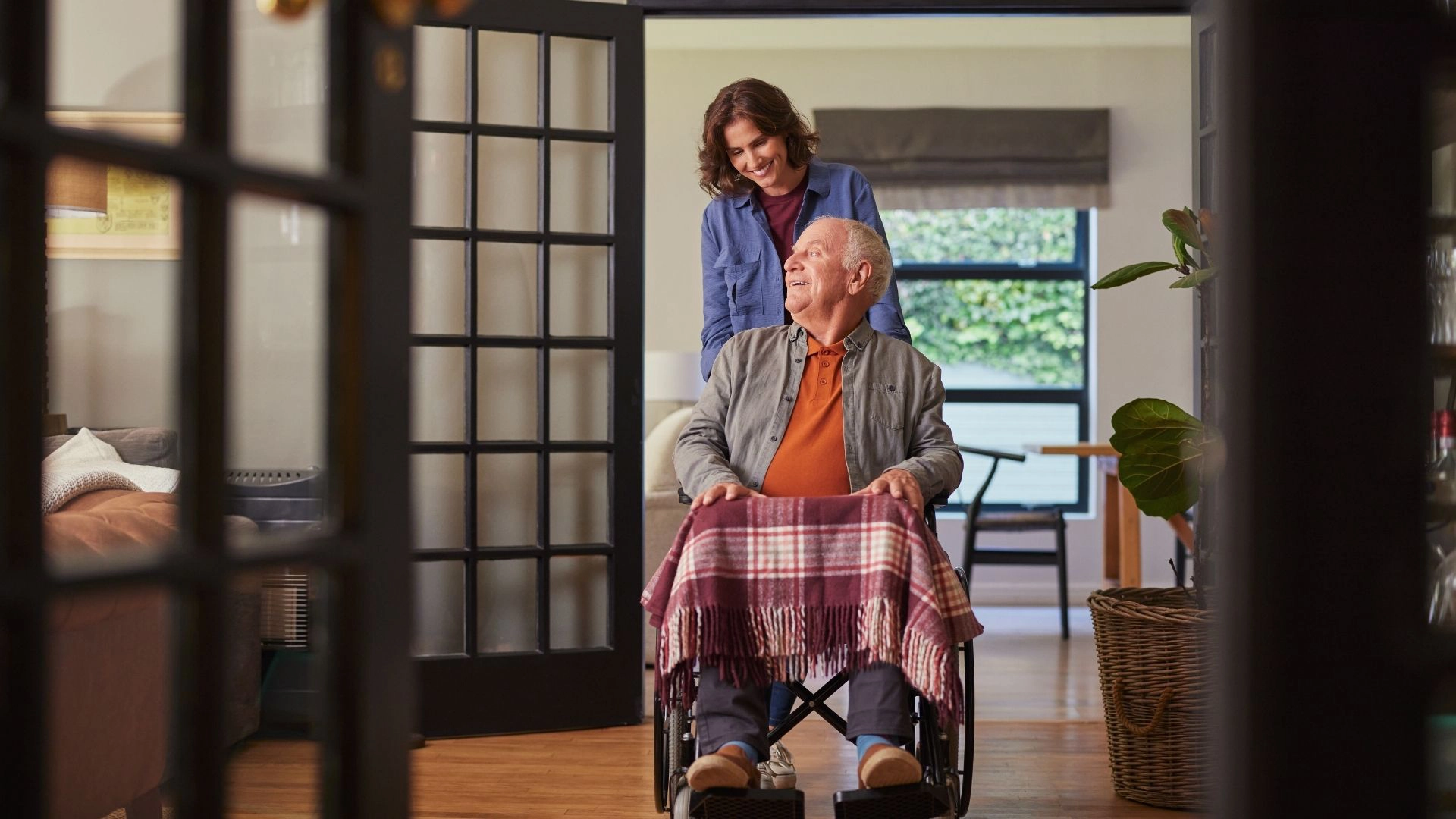 Caregiver assisting senior in their home