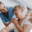 A female caregiver helping an older woman with stroke recovery at home.