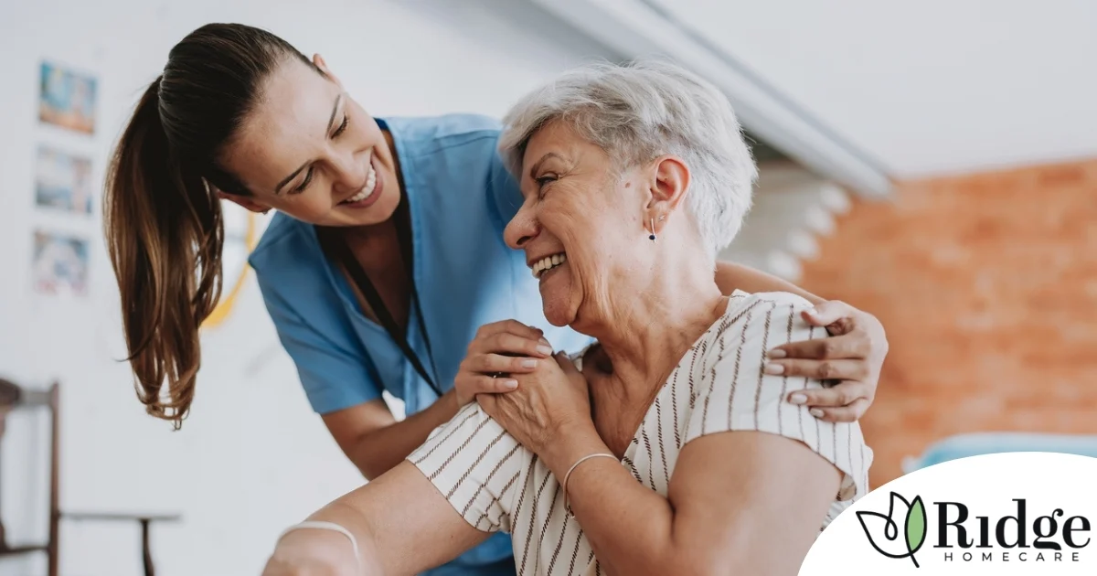 A female caregiver helping an older woman with stroke recovery at home.
